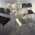 Omsktak (1971), a perforated pressed steel stacking chair by Rodney Kinsman